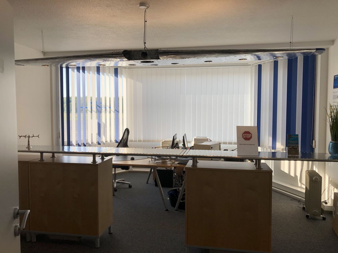 Riveted aluminium reception counter under a wing light