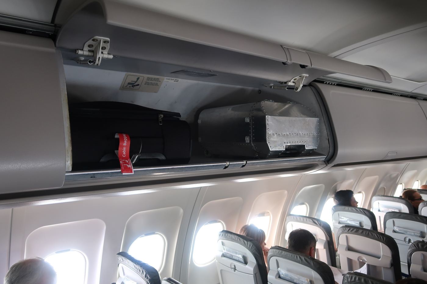 The Taildragger in an overhead bin next to a regular trolley